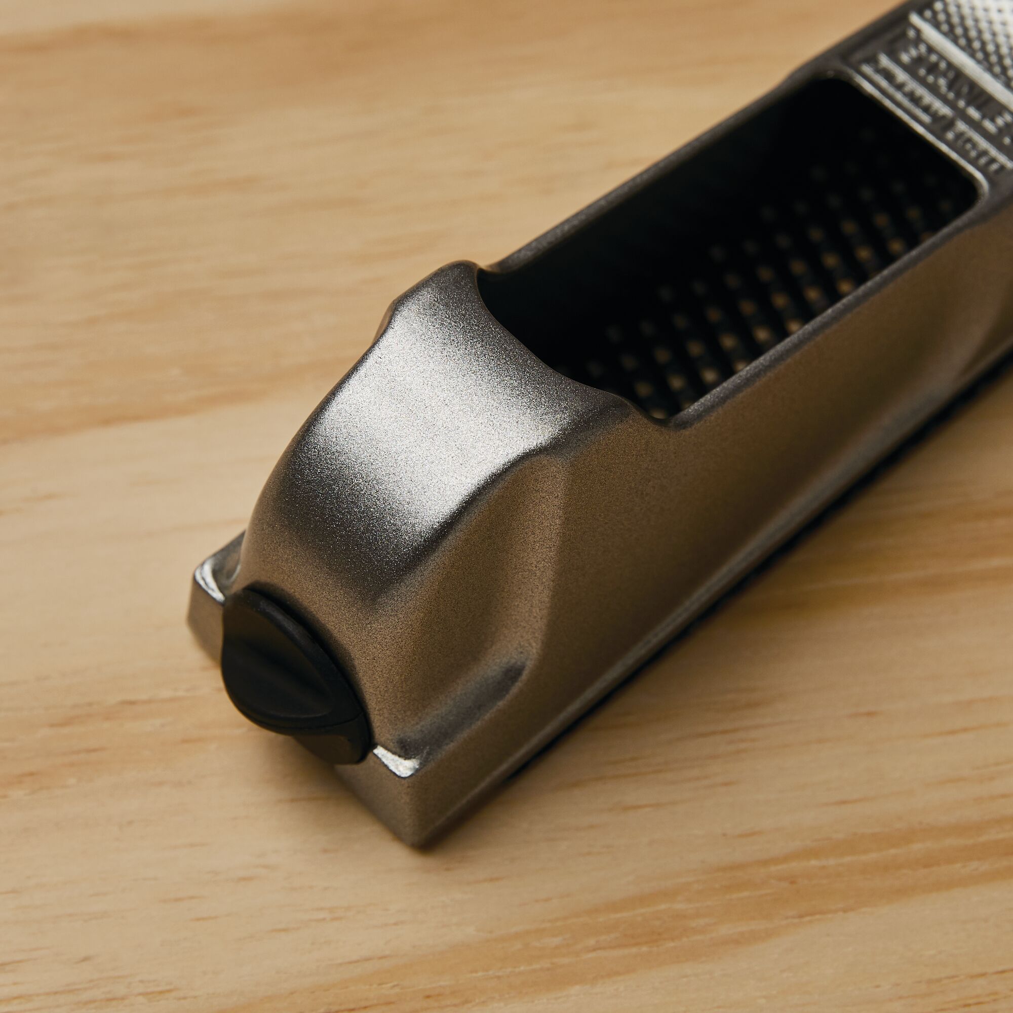 STANLEY 21-399 metal hand rasp tool on light wood surface, close-up angle.