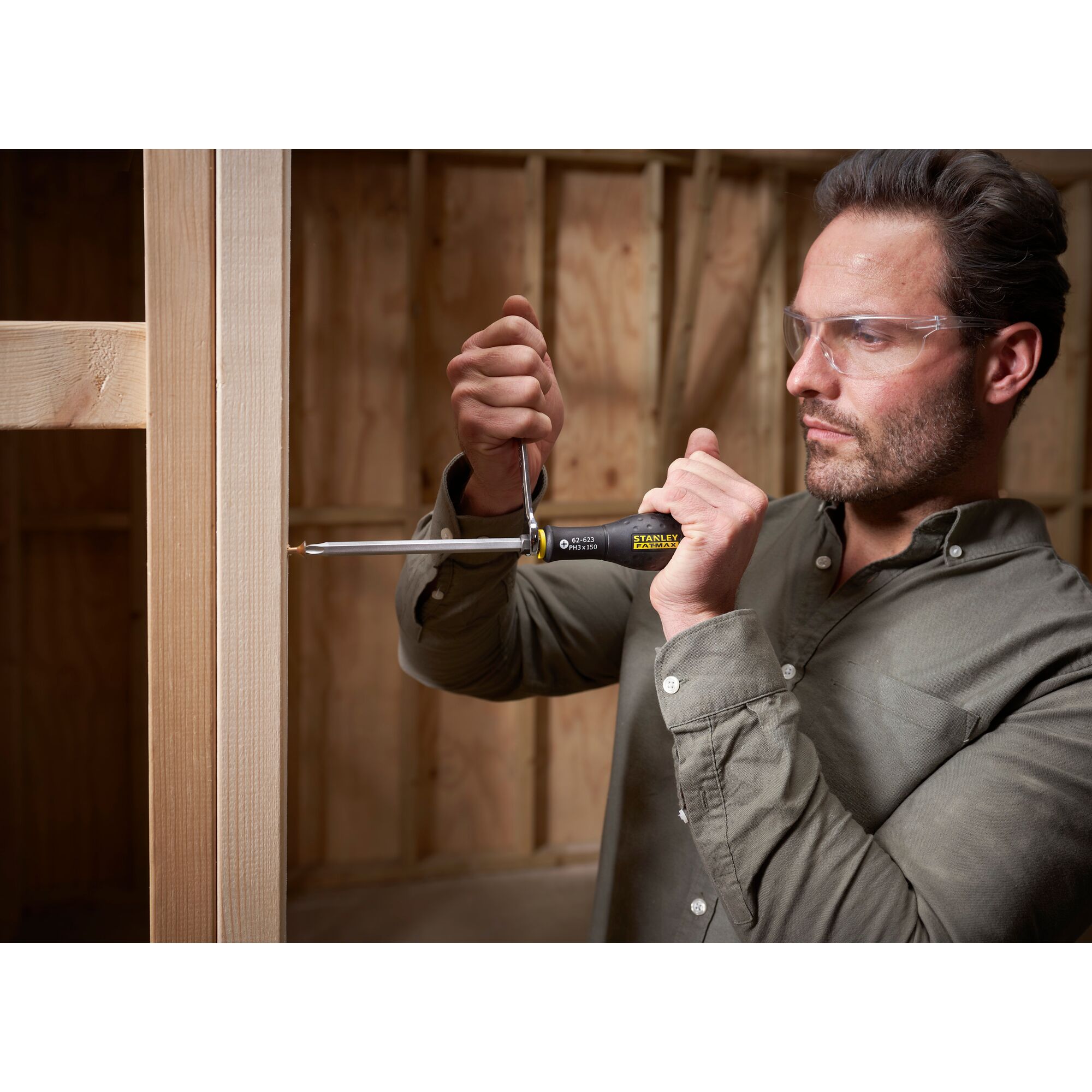 STANLEY FMHT0-62623 screwdriver in use for woodworking, close-up photo, product held in hand.