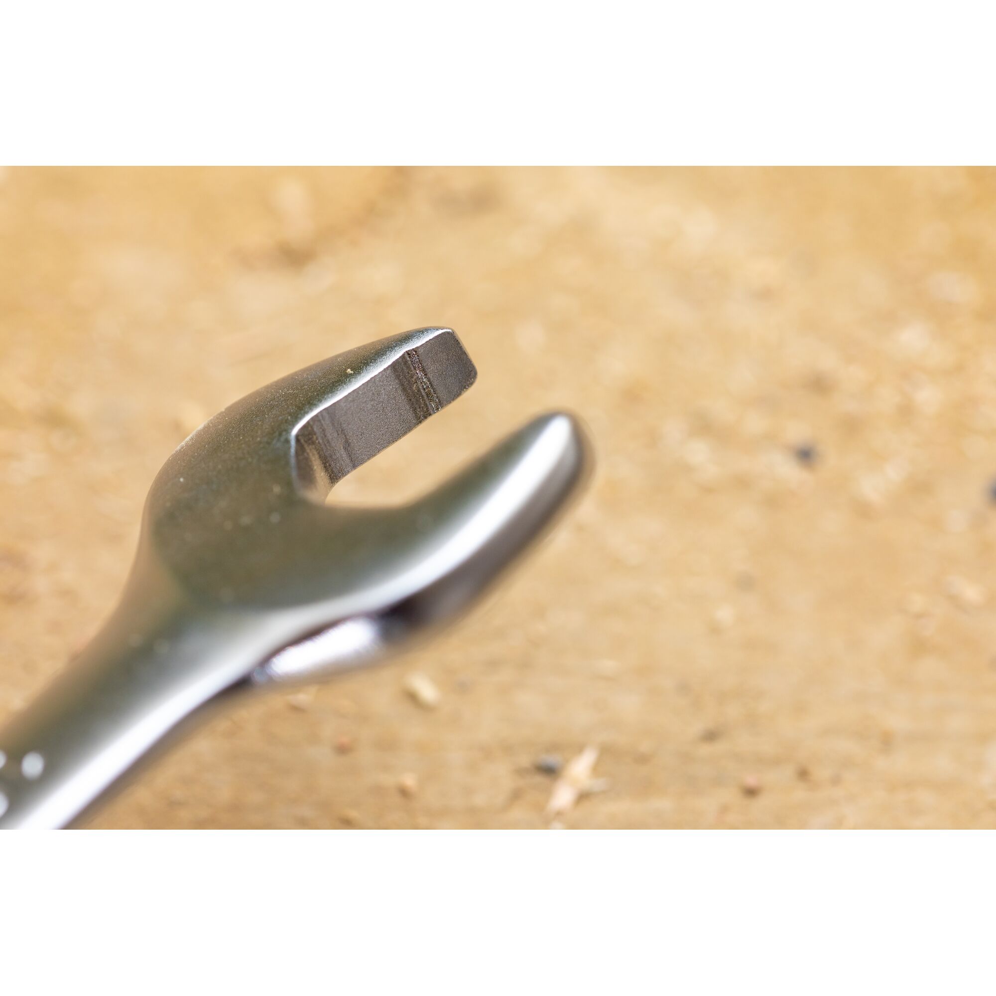 STANLEY FMMT13094-0 open-end wrench close-up, silver metal tool on wood surface, photography